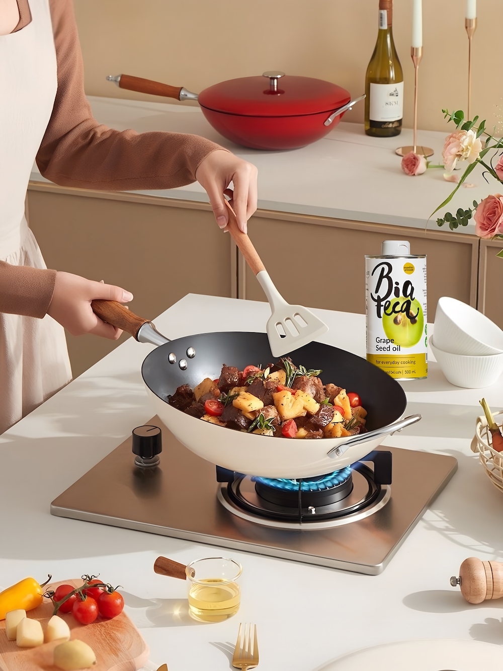 Cooking with Bioteca Grape Seed Oil in modern kitchen